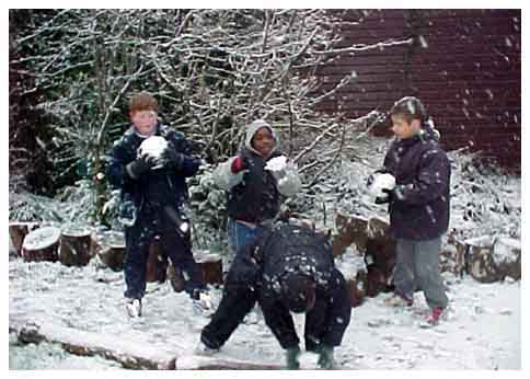 Children playing in the snow at Eveline Lowe Primary School